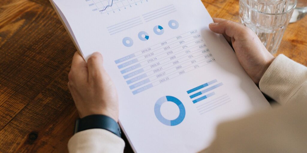 business-charts-2 A lender employee looks at charts to analyze a small business's creditworthiness.