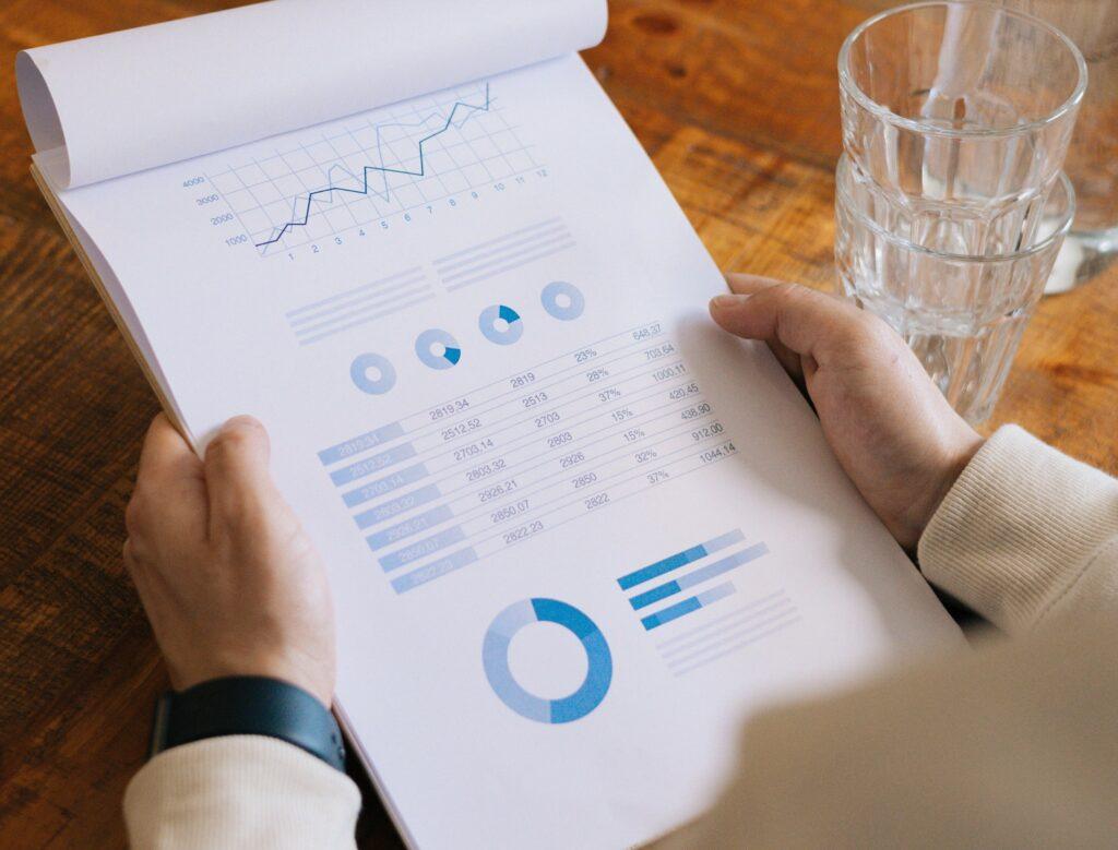 business-charts-mask-left-center A lender employee looks at charts to analyze a small business's creditworthiness.